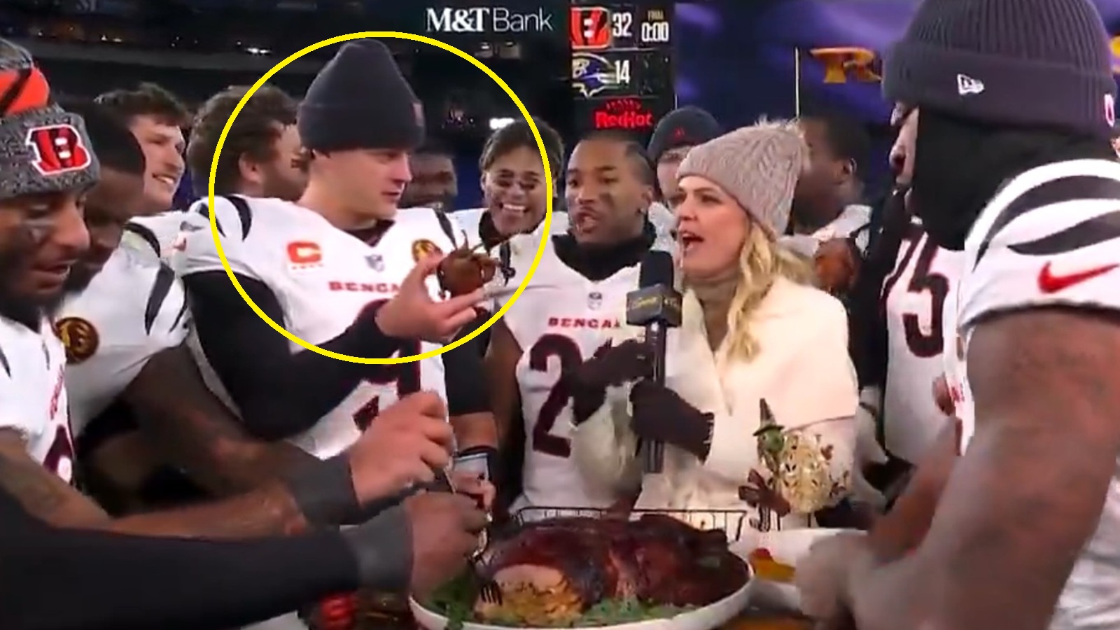 Joe Burrow holding up crab