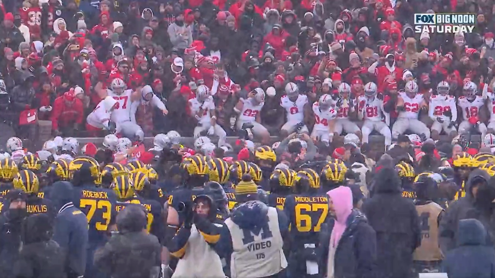 Michigan players defending their logo