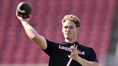 Miller Moss throwing a pass