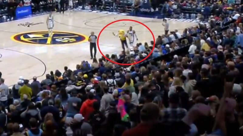 Russell Westbrook pushing Rocky the mascot