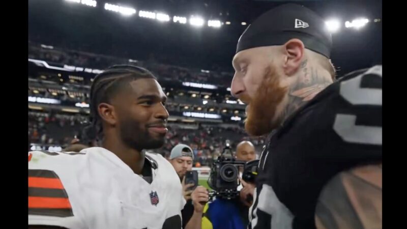 Shedeur Sanders and Maxx Crosby talking after a Browns-Raiders game