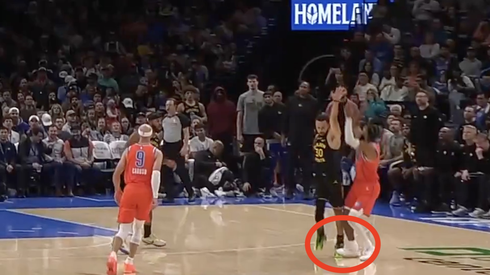 Warriors star Steph Curry delivering a flagrant foul to Thunder guard Isaiah Joe