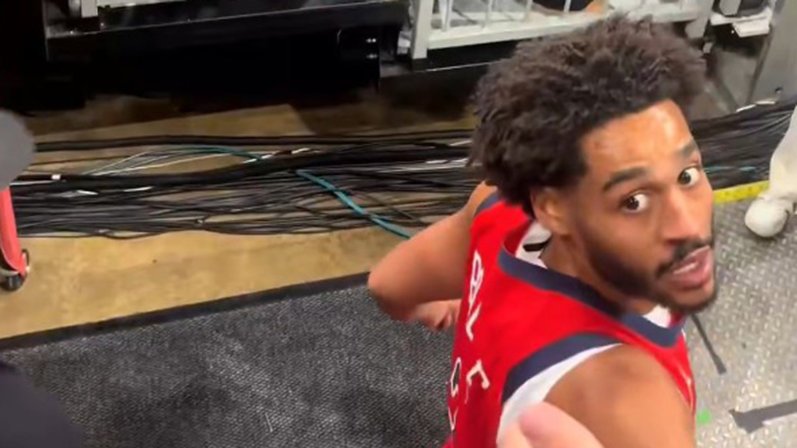 Jordan Poole looking at a fan