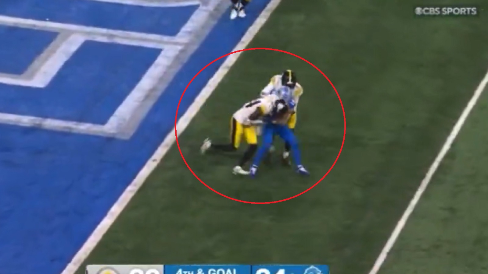 Amon-Ra St Brown wrapped up by two Steelers