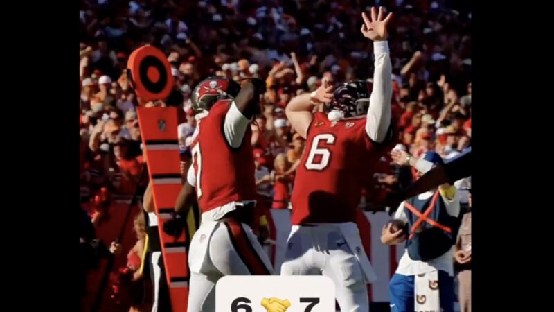 Baker Mayfield and Bucky Irving doing the "nose swipe" celebration