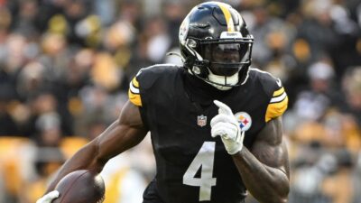 DK Metcalf holds a ball