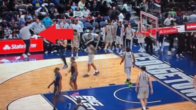 Ed Cooley throwing a water bottle
