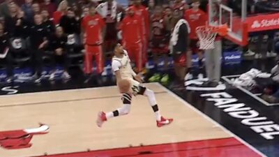 Bucks star Giannis Antetokounmpo going up for a windmill dunk