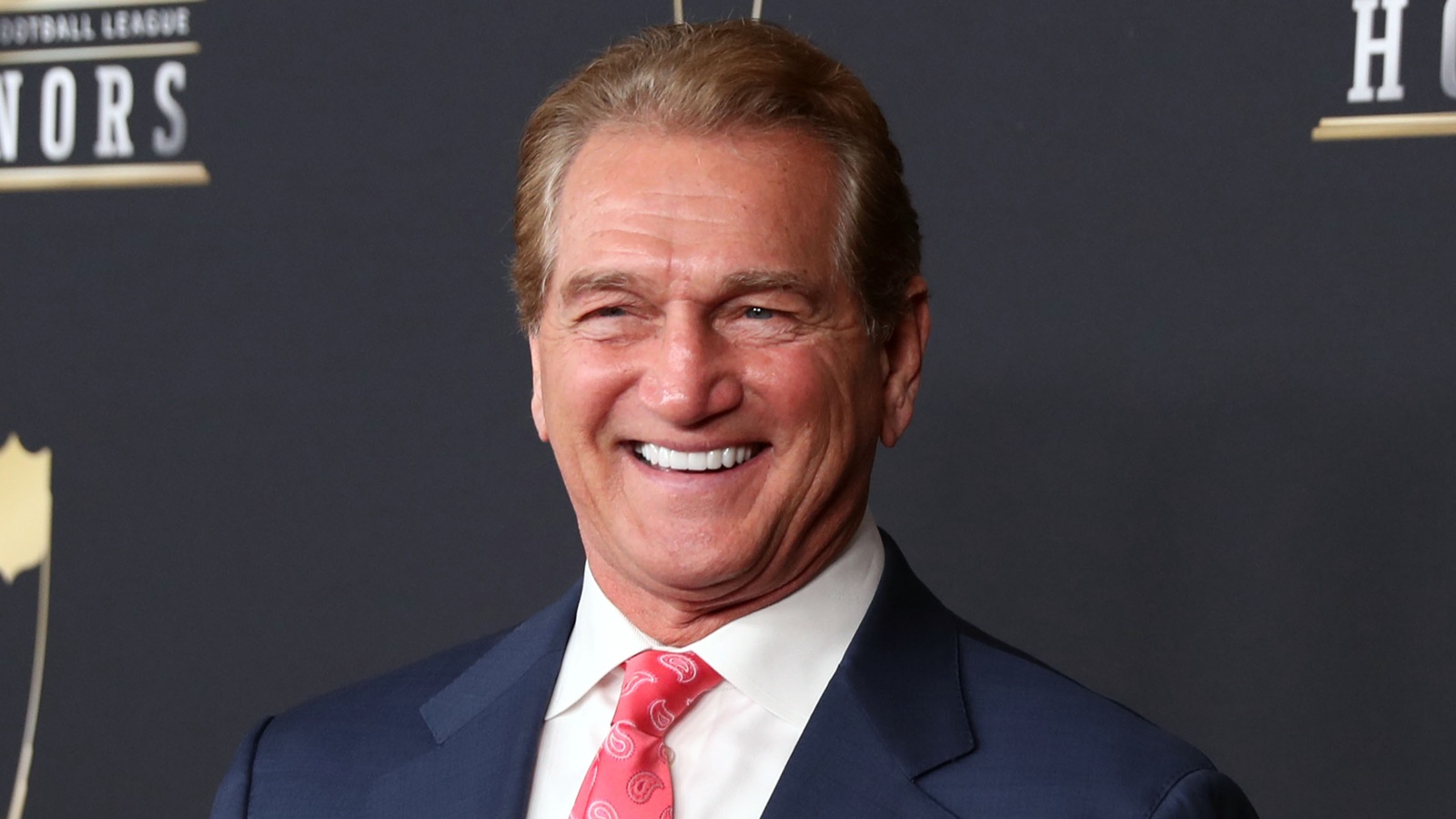 Joe Theismann posing for a photo