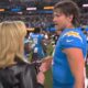 Justin Herbert being interviewed by Laura Rutledge