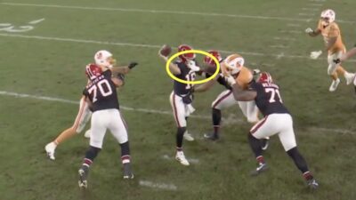 Falcons QB Kirk Cousins getting his face mask grabbed by a Buccaneers linebacker