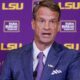 Lane Kiffin holds up his hand