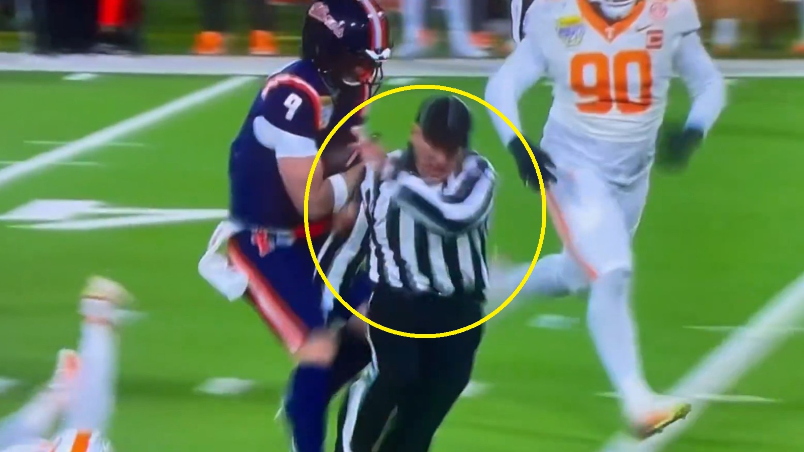 Luke Altmyer running over a referee