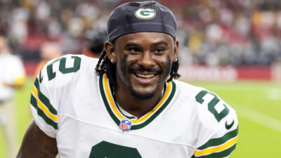 Malik Willis in a Packers uniform smiling