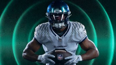 A Seahawks player holding a ball