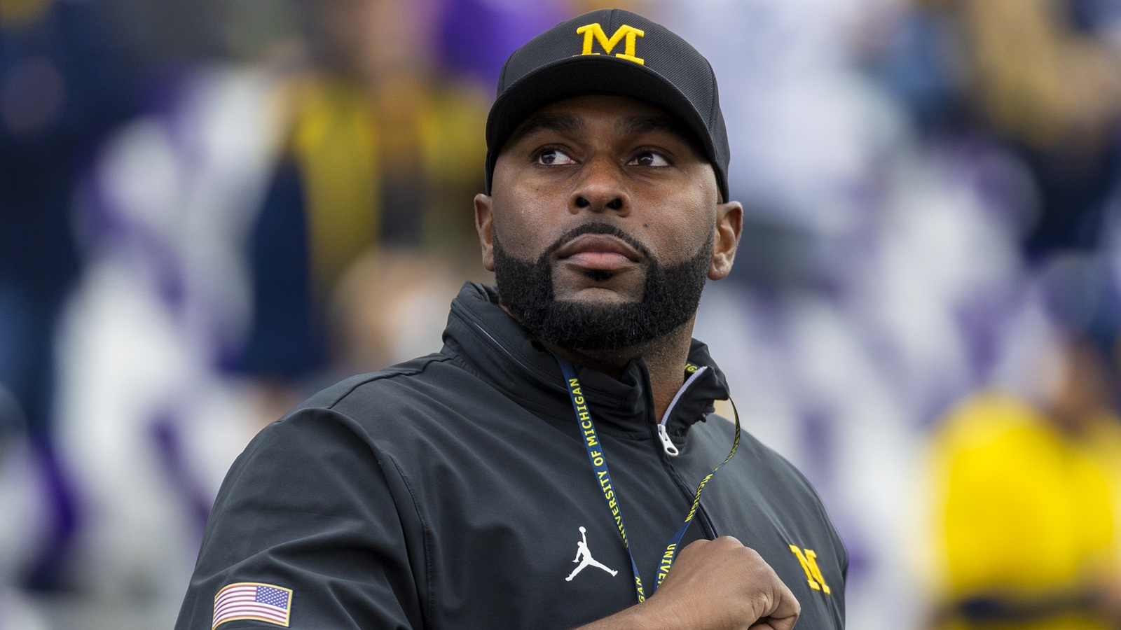 Sherrone Moore looking on