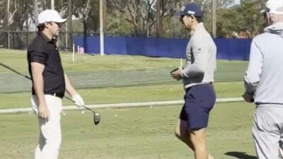 Brooks Koepka greeting Billy Horschel