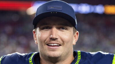 Drew Lock wearing a Seahawks cap