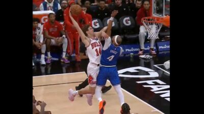 Matas Buzelis dunking on Jalen Suggs
