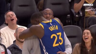 Knicks coach Mike Brown hugging Warriors star Draymond Green
