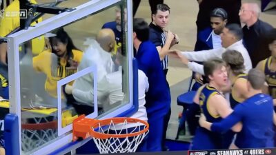 Notre Dame coach Micah Shrewsberry charging a referee after a loss to Cal