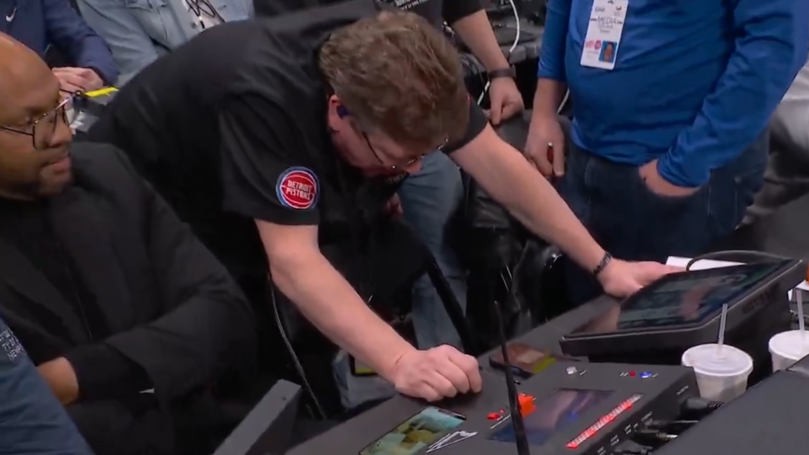 Detroit Pistons IT staff attempting to fix arena horn.