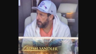 Adam Sandler wearing a Patriots hat