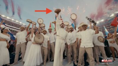 Bad Bunny holding a football in the end zone to close his Super Bowl halftime show