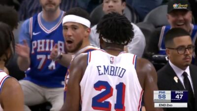 Devin Booker and Joel Embiid having a heated exchange