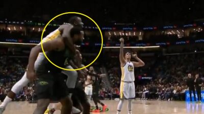 Draymond Green jumping onto DeAndre Jordan