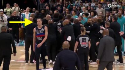 Duncan Robinson walking away as Pistons-Hornets brawl takes place behind him