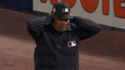 Laz Diaz covering his ears