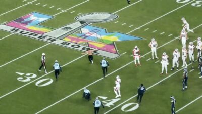 Patriots wide receiver Kyle Williams stalking a Super Bowl 60 streaker