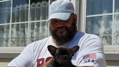 Former Washington Pro Bowler Tre' Johnson holding a dog