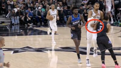 Victor Wembanyama getting hit by Desmond Bane during a Spurs-Magic game