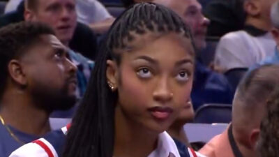 Angel Reese watching an NBA game