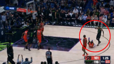 Dejounte Murray standing over Jamal Shead