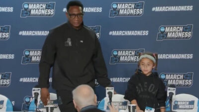 Kenny Blakeney standing up after a press confernece