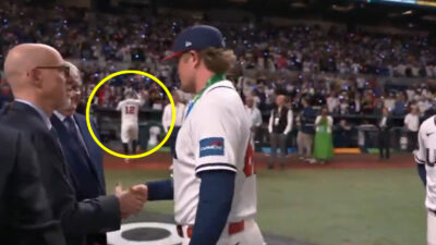 Kyle Schwarber takes off his silver medal