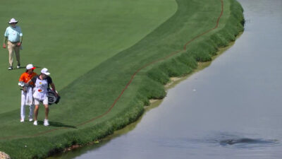 Rickie Fowler and a caddie