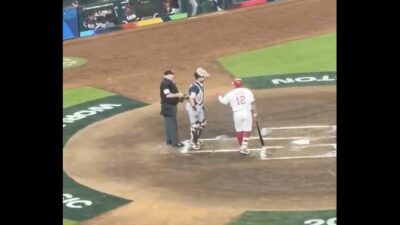 Team USA's Cal Raleigh snubs Team Canada batter and his Seattle Mariners teammate Josh Naylor's fist bump during World Baseball Classic game