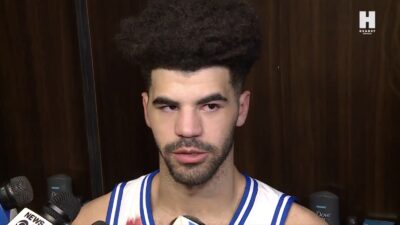 Duke's Cayden Boozer speaking to reporters after losing to UConn