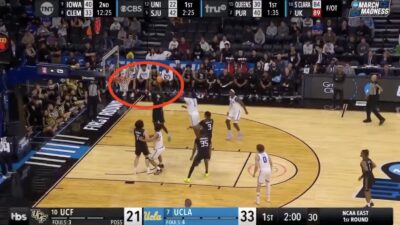 UCF center John Ball scoring on his own team's basket against UCLA