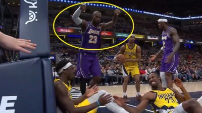 LeBron James pointing at two defenders