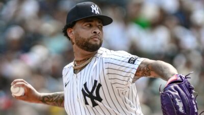 Luis Gil throwing a pitch