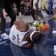 Warriors wing Moses Moody grabbing his left knee after suffering an injury