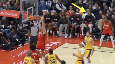 Reed Sheppard dunking while Kevin Durant celebrates from the bench