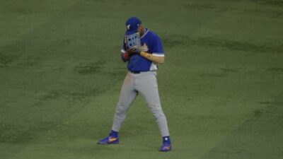 Ronald Acuna Jr. crying into his glove after Venezuela beat Italy in WBC semifinal