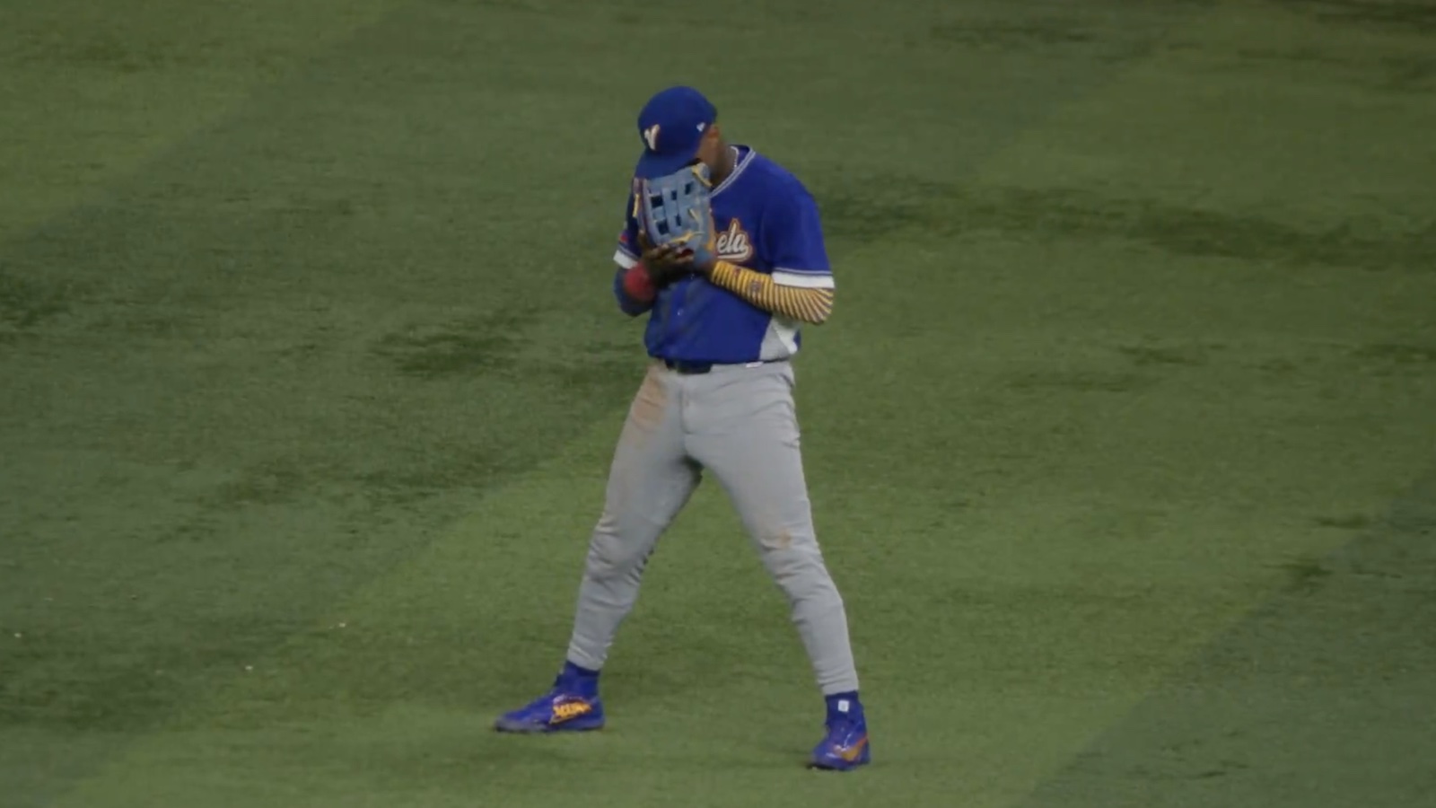 Ronald Acuna Jr. crying into his glove after Venezuela beat Italy in WBC semifinal