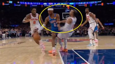 Shai Gilgeous-Alexander running over Jalen Brunson